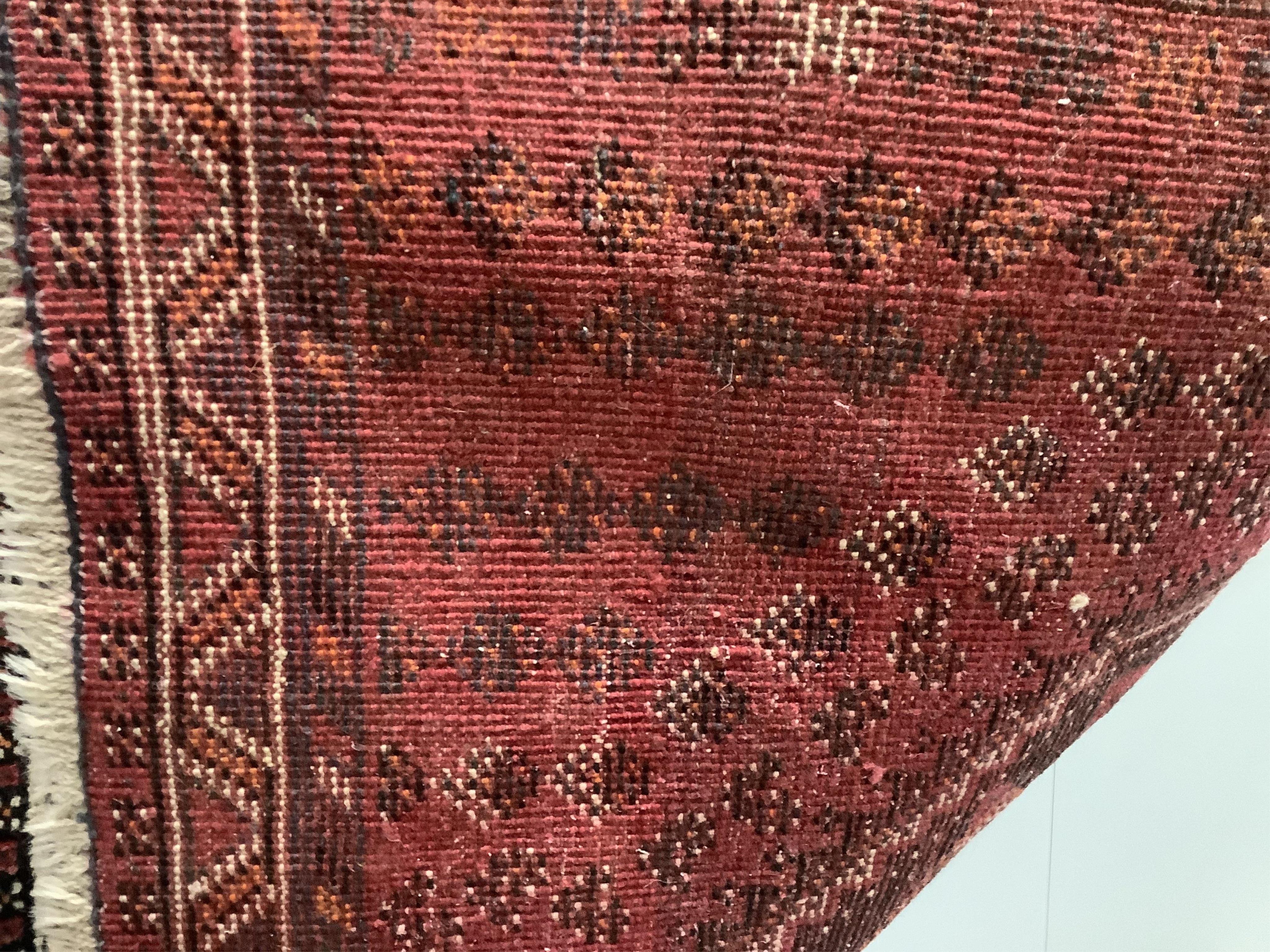 A Hamadan red ground rug, 150 x 108cm together with a North West Persian style rug and an Afghan runner. Condition - fair